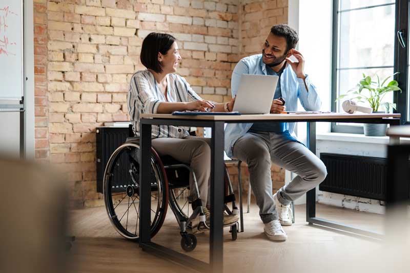 Participant reviewing NDIS plan management Australia budget on laptop at home